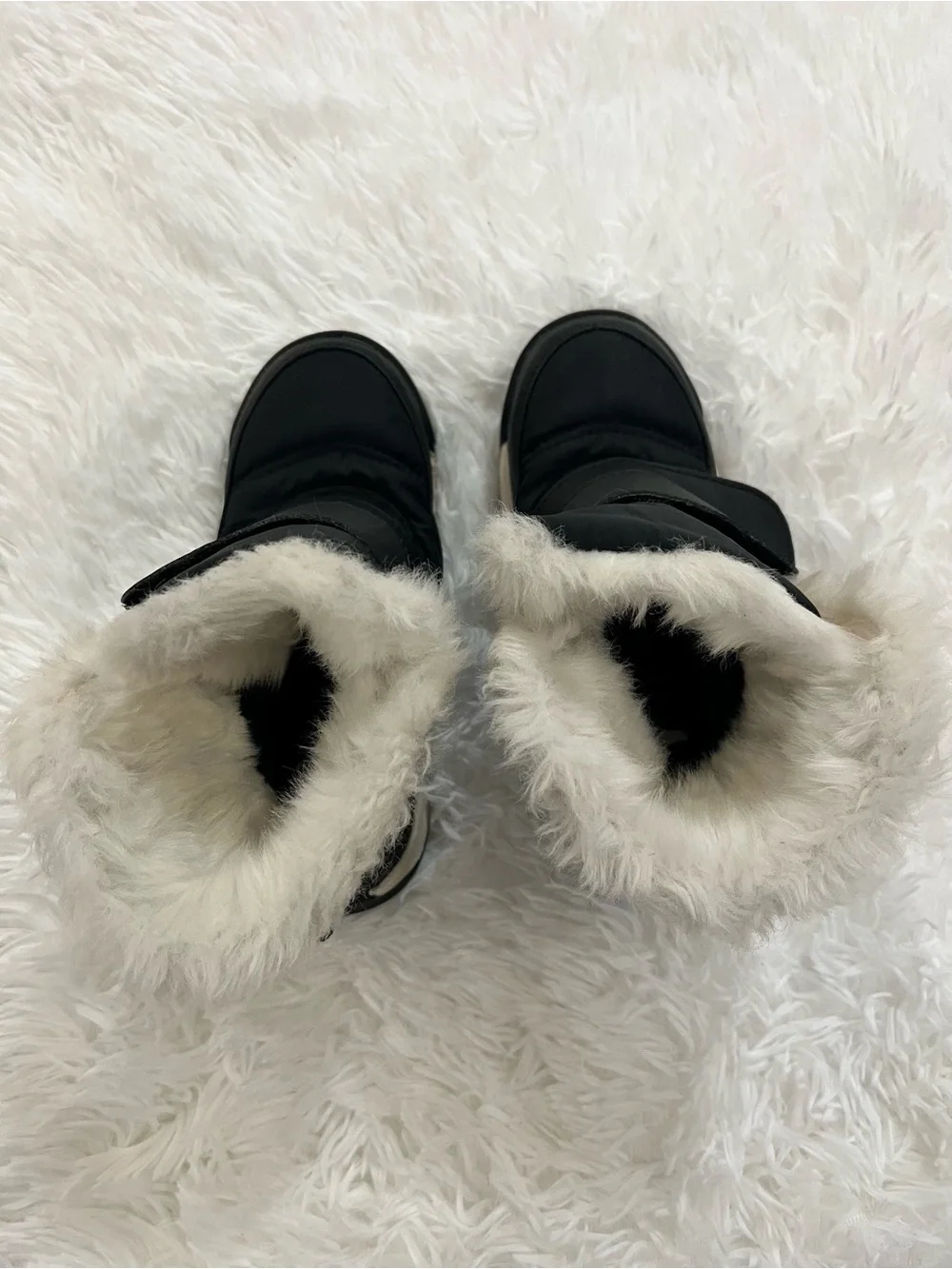 SOREL Kids black and white faux fur winter boots